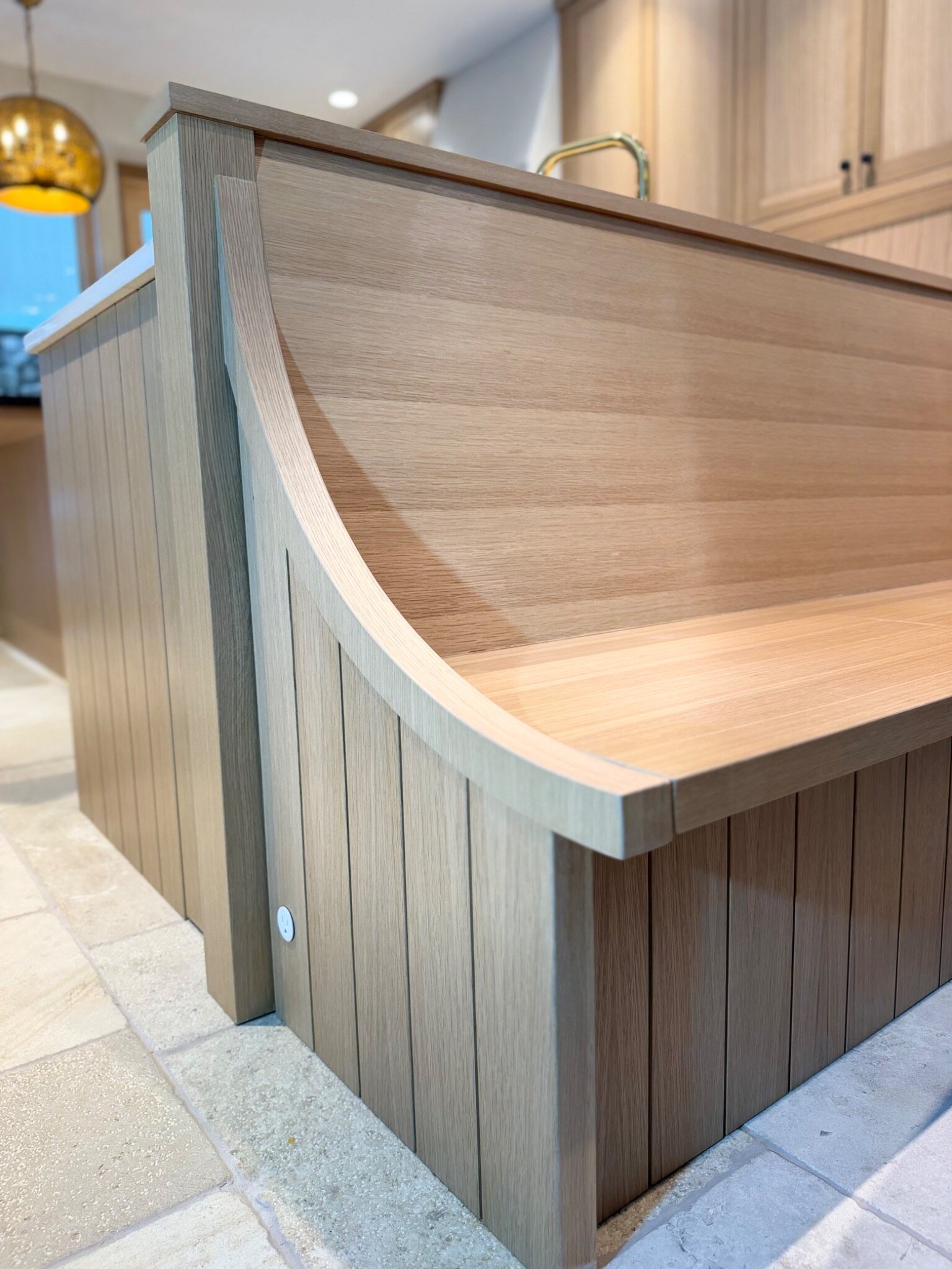 Curved custom millwork detail in white oak