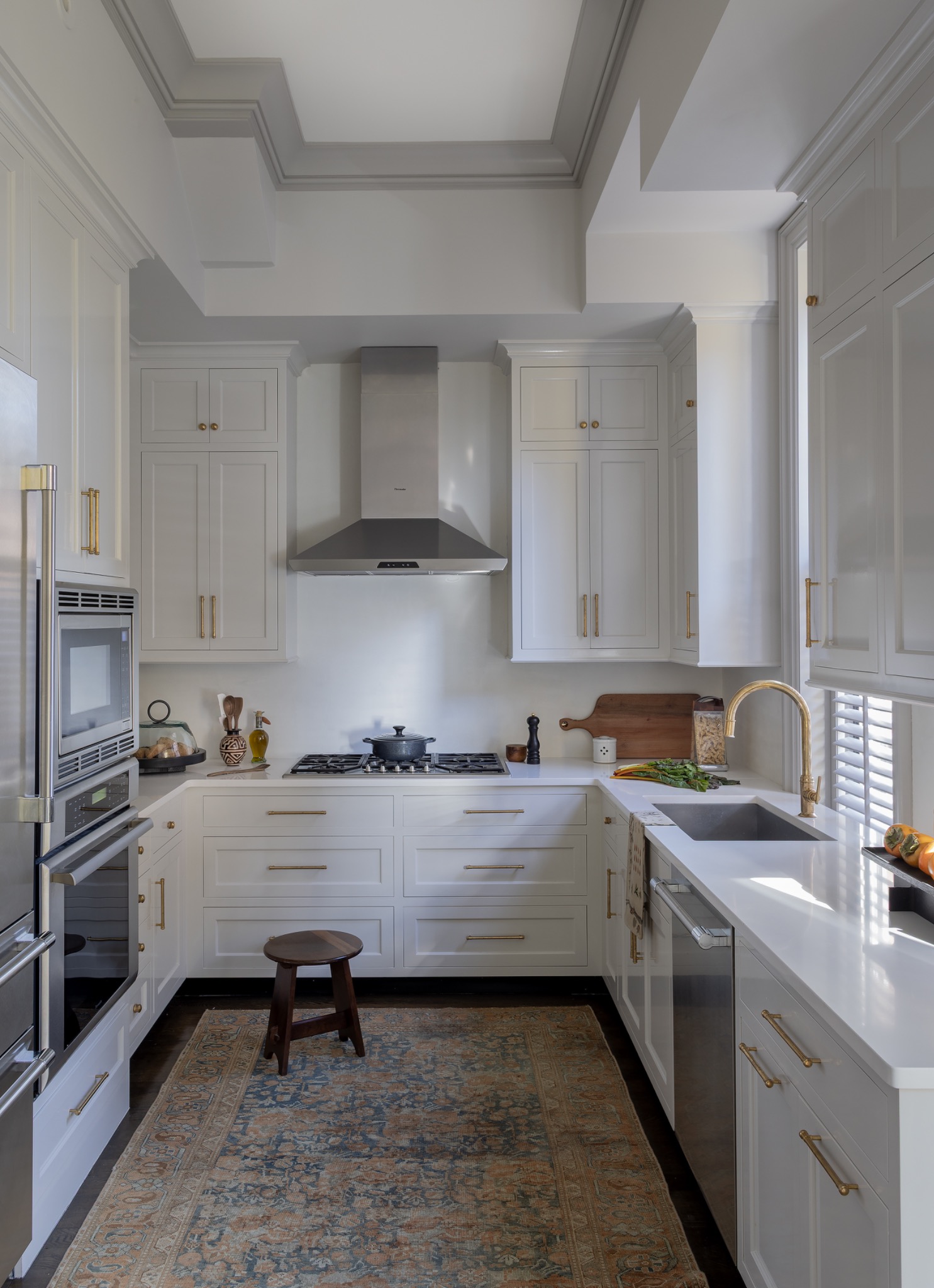 Bright kitchen with traditional cabinetry and detailed trim